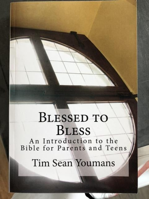 "Blessed to Bless" book, by Father Youmans